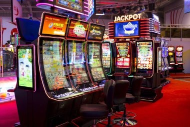 Texas Hold'em Bonus card hands displayed on mobile phone screen showing community cards and player decisions